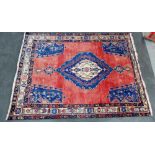 Eastern rug with red field and central lozenge, 150 x 200cm