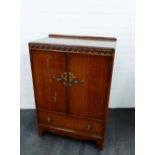 Early 20th century oak ledgeback cabinet with cupboard doors above a single drawer, 105 x 73cm