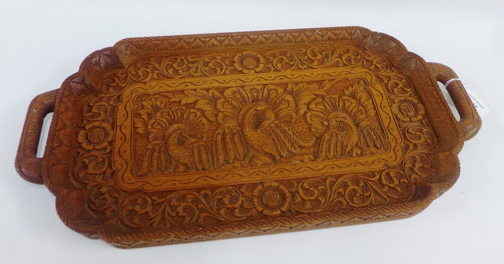 Indian carved hardwood tray with peacocks and flowerhead pattern and twin handles, 58cm long