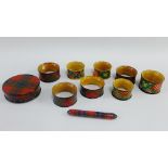 Group of late 19th century Mauchline 'Tartan Ware' to include eight napkin rings, snuff box,