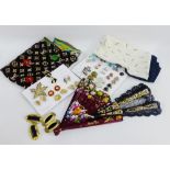 A mixed lot to include an Yves St Laurent scarf, clip on earrings, Trifari