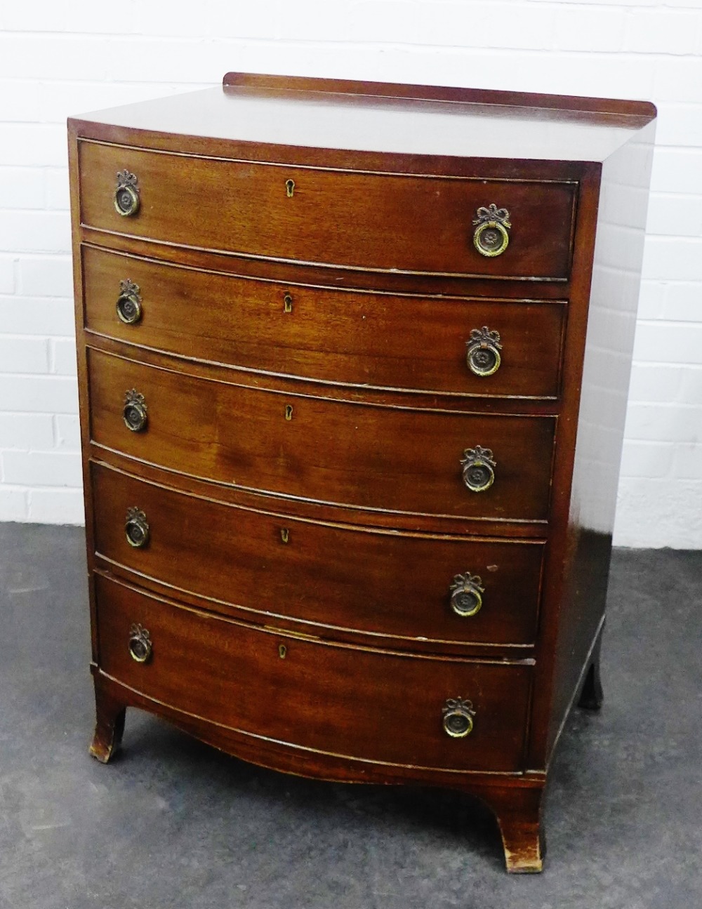 Mahogany bow front chest with five graduated long drawers, on bracket feet, 88 x 61cm,