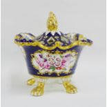 Early 19th century Coalport Mazarine blue and floral pot pourri vase and cover on gilt paw feet, (