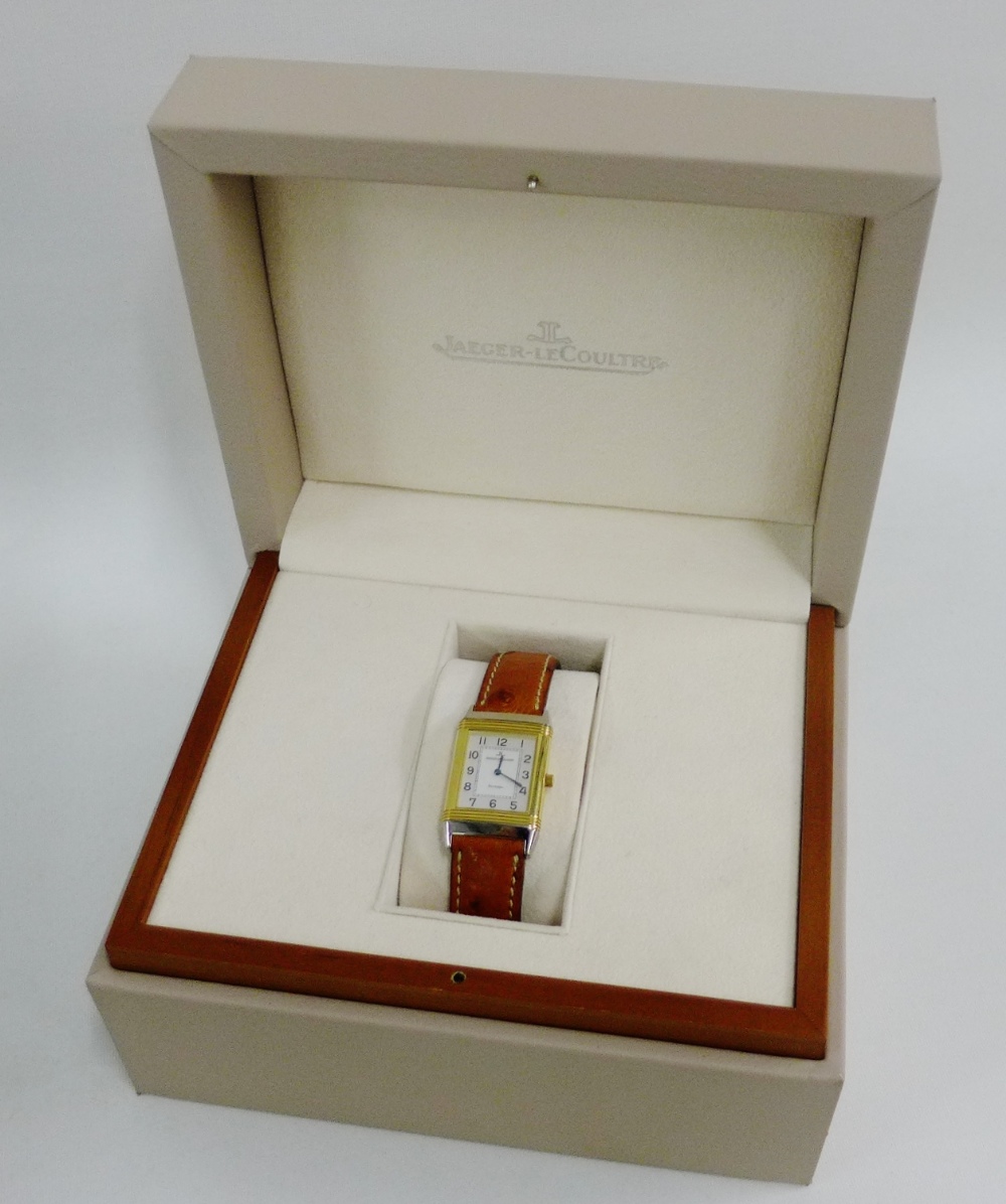 Lady's Jaeger Le Coultre bi colour Reverso wristwatch with silvered dial and black Arabic numerals