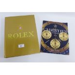 Rolex, Timeless Elegance, a hardback book by George Gordon, together with a Christie's Rolex Watch