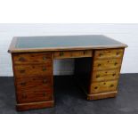 Victorian mahogany twin pedestal desk, the rectangular top above a central frieze drawer flanked