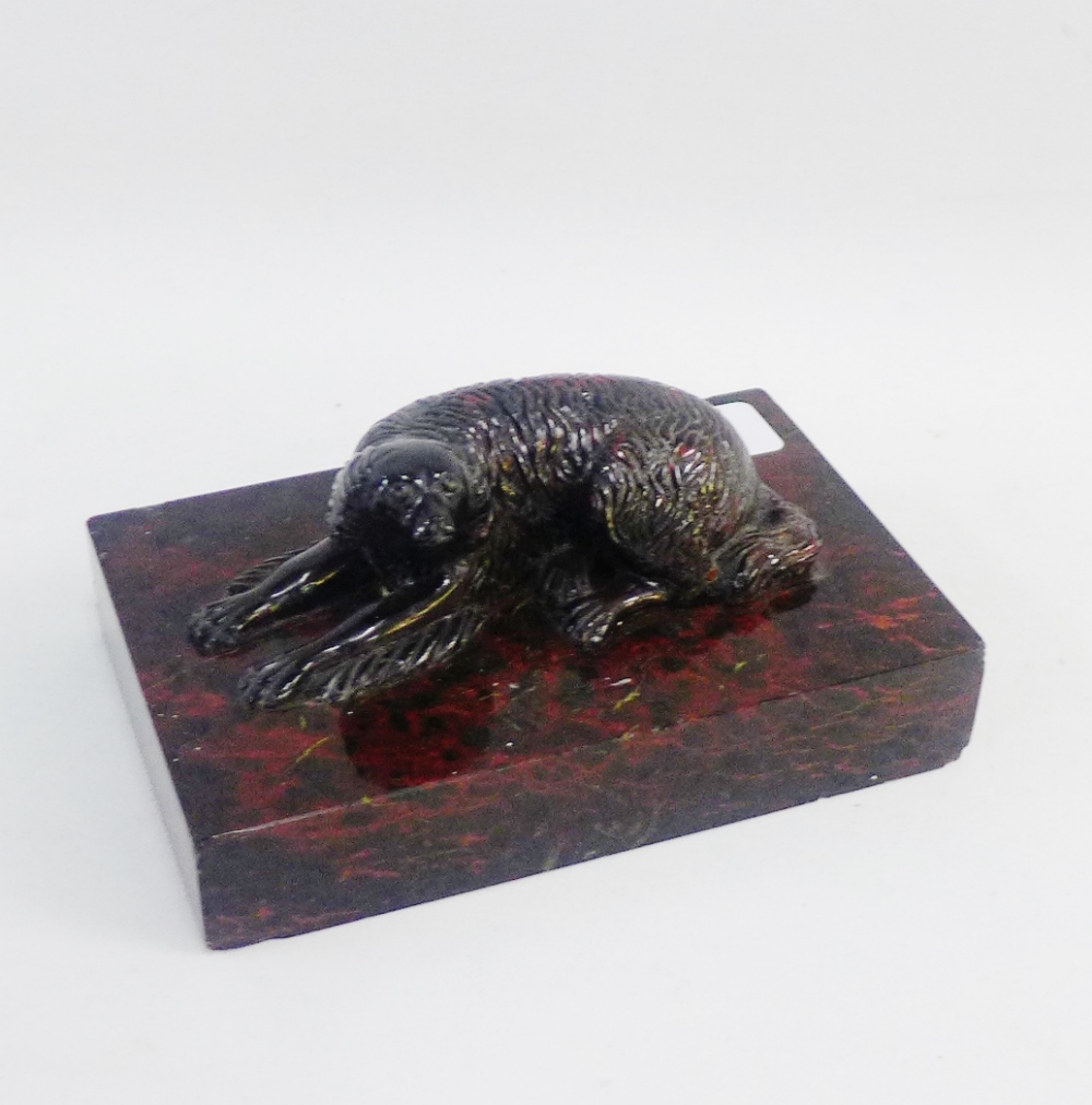 19th century carved serpentine model of a Spaniel on a rectangular plinth base, 16cm long