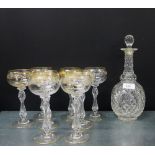 Cut crystal decanter and stopper, together with a set of eight wine glasses with gilt etched