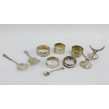 Mixed lot to include a pair of Birmingham silver knife rests, three silver napkin rings and two