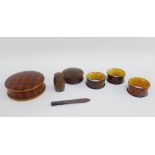 Group of late 19th century Mauchline 'Tartan Ware' to include three napkin rings, thimble box,