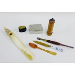 A mixed lot to include a white metal mounted horn letter opener, lignum vitae cylindrical box,