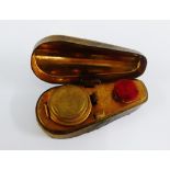 A novelty Victorian travelling inkwell in the form of a coffin, 8.5cm long