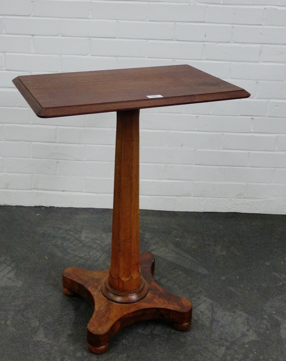 Mahogany side table, the rectangular top with moulded edge, raised on a pedestal base, 74 x 58cm