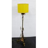 An early 20th century brass and copper standard lamp and shade, 180cm