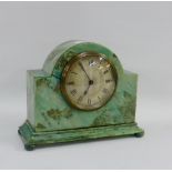 Art Deco green marbled Bakelite mantle clock, the silvered dial with Arabic numerals, on four bun