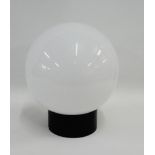 A retro light fitting with globular opaque glass shade