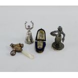 A mixed lot to include an Edwardian silver miniature figure, a silver and mother of pearl baby