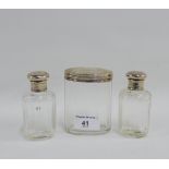 Three Edwardian silver topped glass toilet bottles / jars, London 1905 (3) tallest 9cm