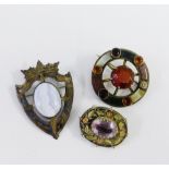 Birmingham silver Luckenbooth style brooch together with two white metal brooches with coloured