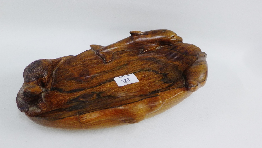 Carved wooden bowl with dolphin, seals and an otter, 35cm long