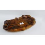 Carved wooden bowl with dolphin, seals and an otter, 35cm long