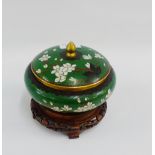 Cloisonne jar and cover, the green ground with white flowers, together with a hardwood pierced