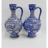 Pair of large German stoneware jugs / ewer's with mask head spout, 41cm high, (2)
