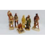 Collection of five stoneware Native North American figures with a carved wood figure, tallest