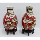 Pair of Japanese earthenware baluster vases, one with a lamp fitting to top, both with hardwood