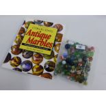 Collection of vintage marbles, together with Collecting Antique Marbles, IV Edition by Paul