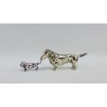 Two white metal miniature Dachshund figures, longest 9cm (2)