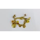 Vintage gold plated charm bracelet with a quantity of 9 carat gold and gold plated charms