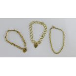 Two 9 carat gold bracelets to include a gatelink and curb link, both with heart shaped padlocks,