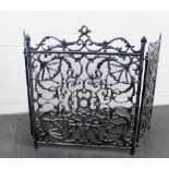 An ornate grey metal fire / spark guard