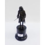 Voltaire, a French bronze figure after Jean-Antoine Houdon, on ebonised cylindrical plinth base,