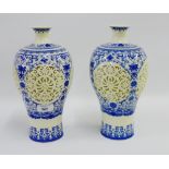 Pair of Chinese blue and white Meiping vases and covers with reticulated floral pierced body and