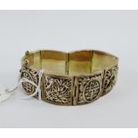 Chinese style silver panel bracelet depicting bamboo, blossom and calligraphy, stamped Silver