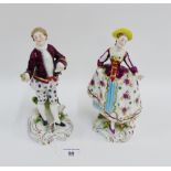 Pair of continental porcelain male and female figures, each dressed in 18th century style costume on