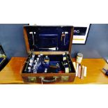 Late Victorian dressing case containing a suite of silver topped bottles and hip flask mainly with