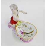 19th century Meissen style figural salt on a puce shell scroll base, decorated with a bird to the