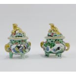 Pair of Chinese Famille Verte twin handled sensors, the covers surmounted by temple dogs, decorated