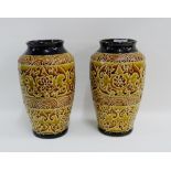 Pair of high shouldered baluster vases with leaf and flower incised pattern, 28cm high, (2)