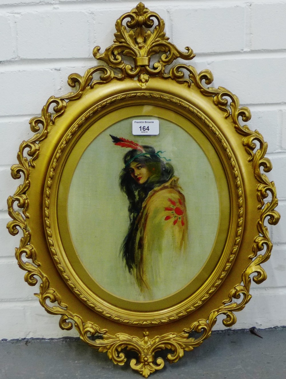 Oval portrait of a 'Girl with Feather Headdress' Oil-on-Canvas, apparently unsigned, contained