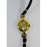 Vintage 9 carat gold cased Lady's Longines wristwatch on a black leather strap