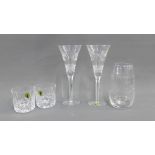 Pair of Waterford crystal whisky tumblers and a pair of Waterford crystal Champagne glasses,