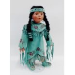 Native American doll in traditional costume