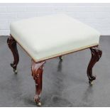 Mahogany stool with upholstered seat, terminating on brass castors 47 x 50cm