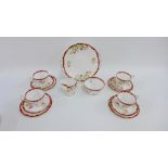 Queen Anne bone china 'Narcissus' patterned teaset comprising ten cups, ten saucers, ten side