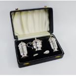 Three piece silver condiment set by Viners, Sheffield 1956, in fitted case