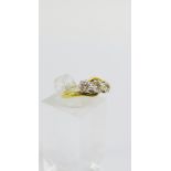 18 carat gold and diamond three stone ring, UK ring size K, stamped 18ct